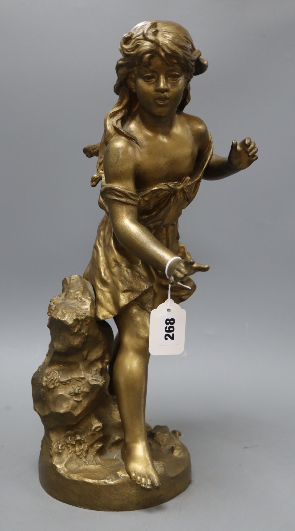 An early 20th century gold painted bronze model of a girl, height 50cm